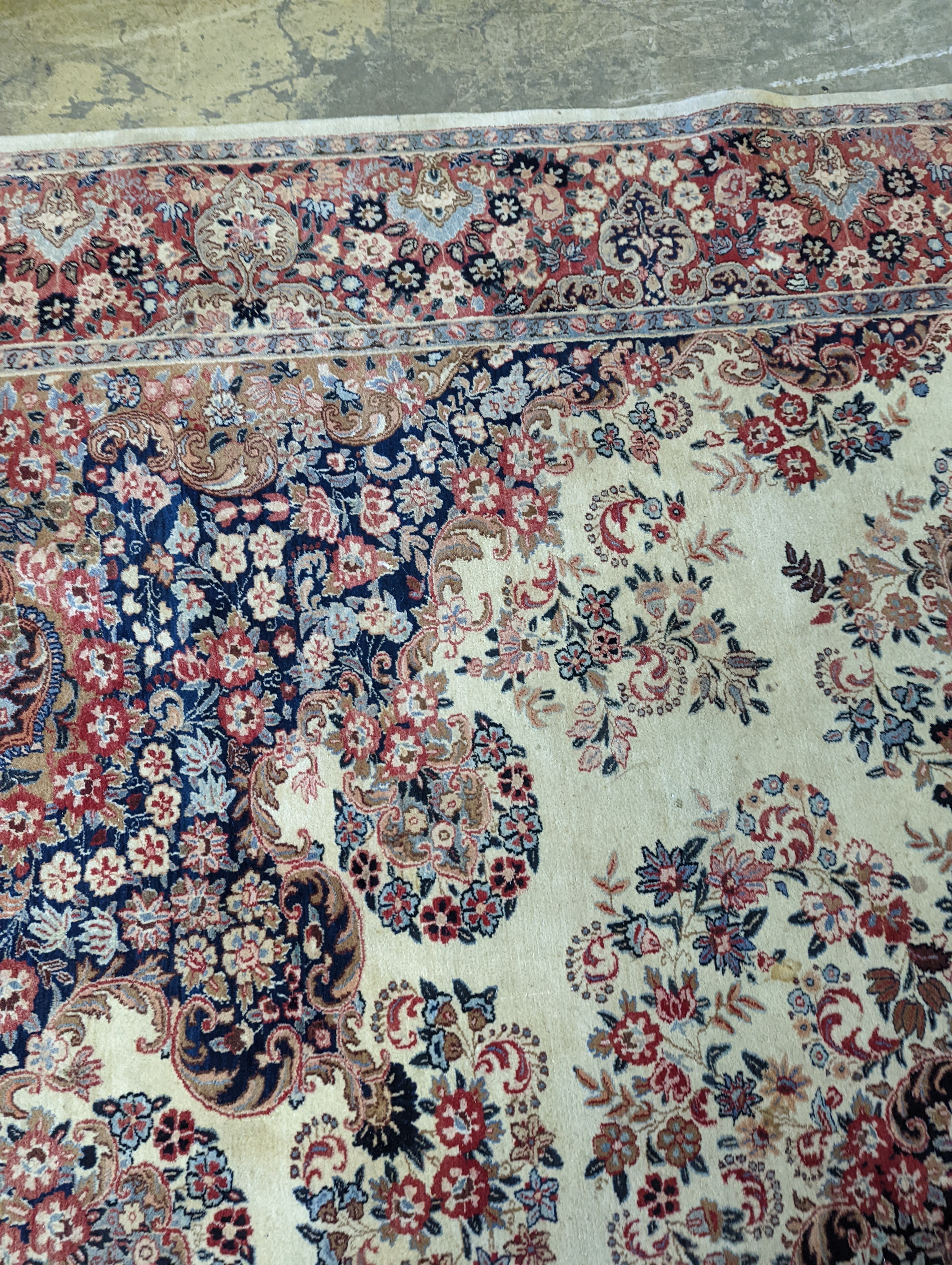 A North West Persian ivory ground carpet, 410 x 310cm